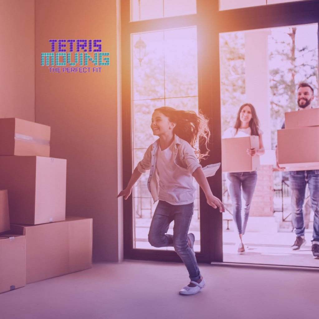 A kid running into a new house with moving boxes littered around the room